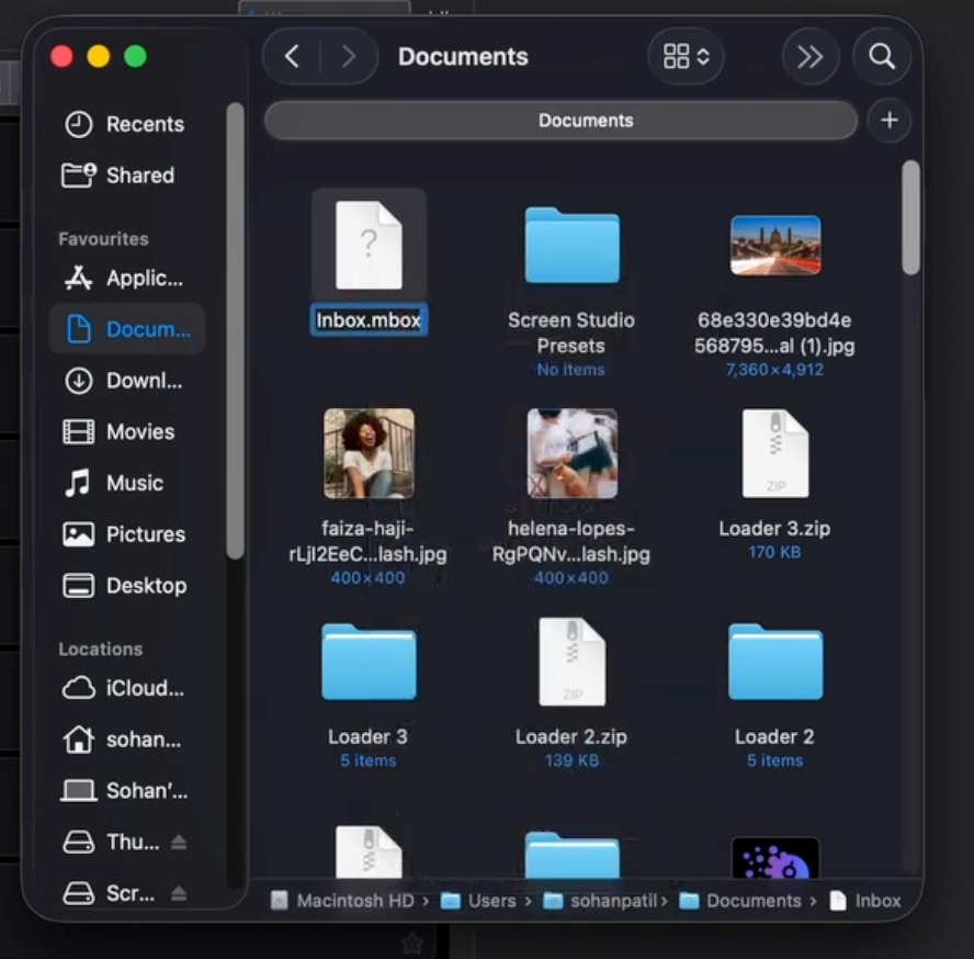 A macOS Finder window displaying document files, images, and folders in a dark mode interface.