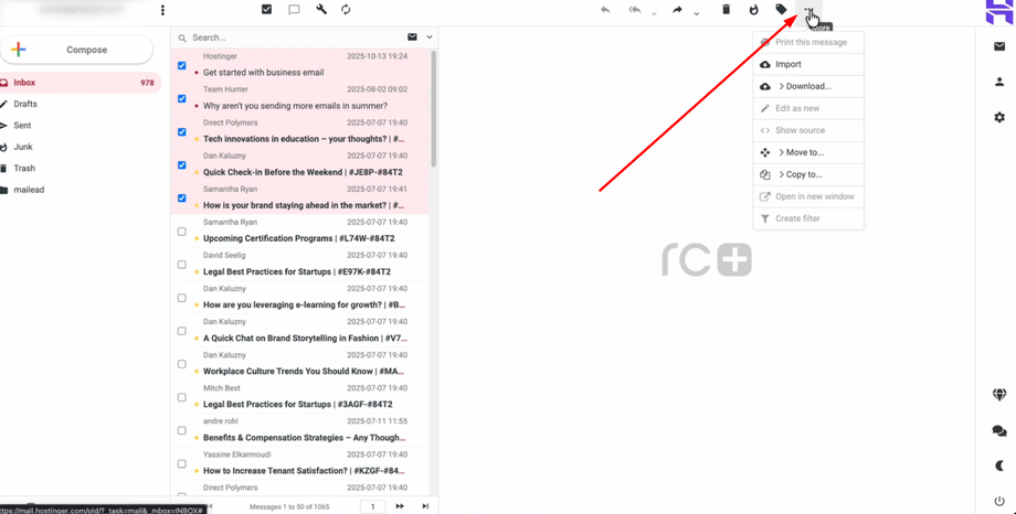 Email inbox with Hostinger messages, showing an arrow pointing to a 'More' dropdown menu with options like Import, Download, and Print.