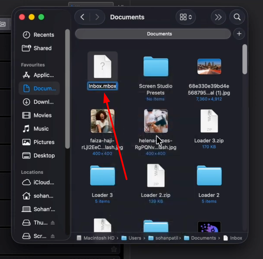 Mac Finder window with dark mode, showing 'Inbox.mbox' file highlighted with a red arrow.