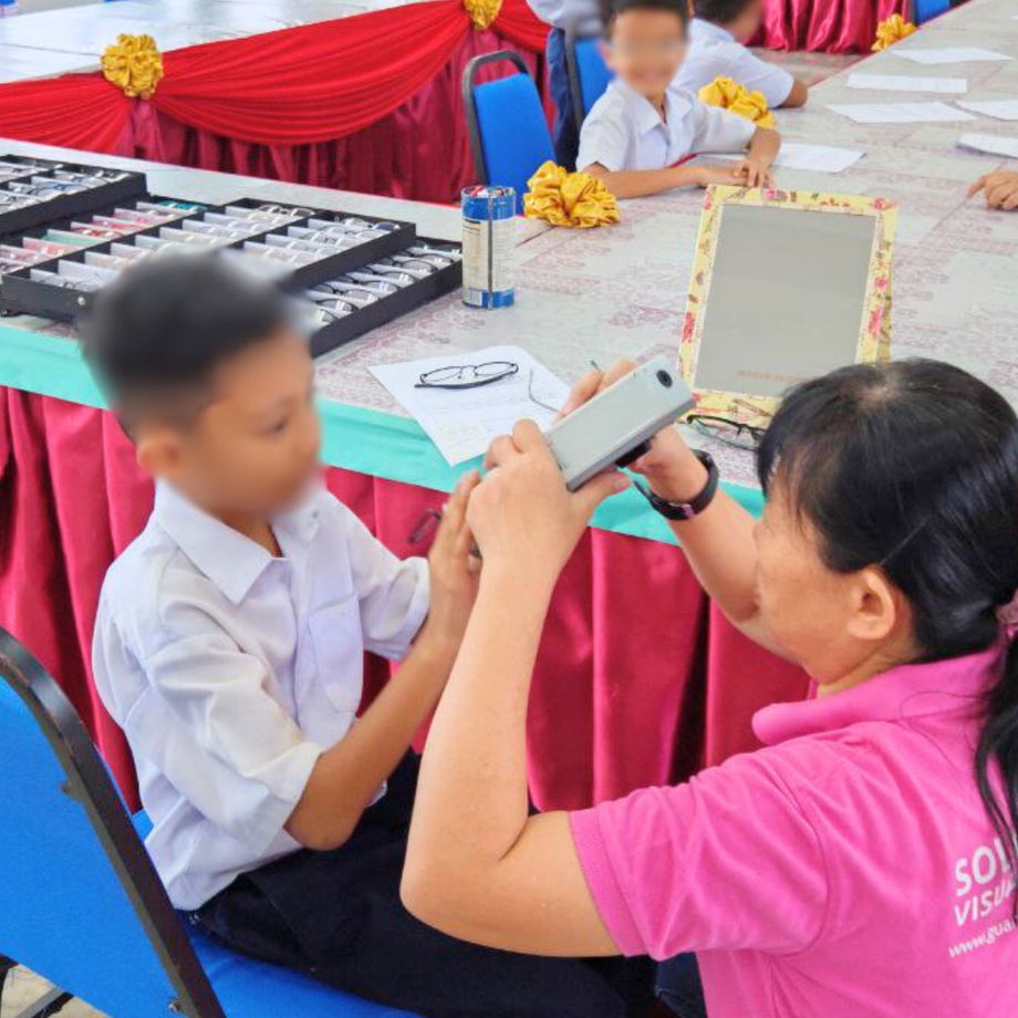 GHL Optical professional performing precise frame fitting and PD measurement for custom spectacles