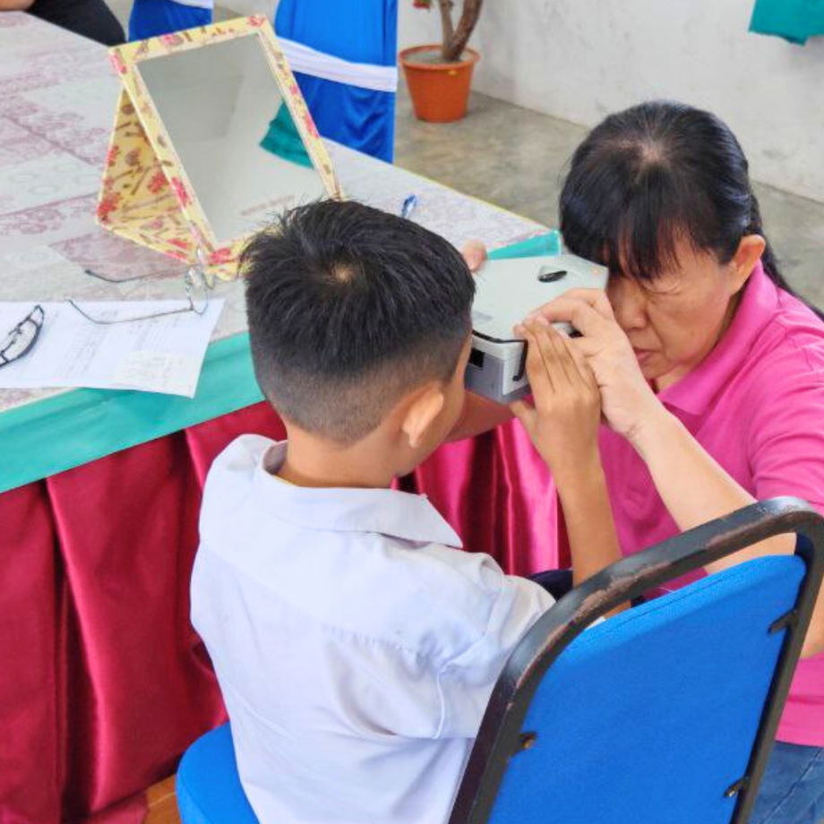 GHL Optical professional performing precise frame fitting and PD measurement for custom spectacles